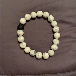 Marbled bracelet with a black bead